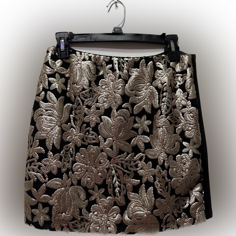 Sparkly mini party skirt. Half sequin in the front and canvas in the back.